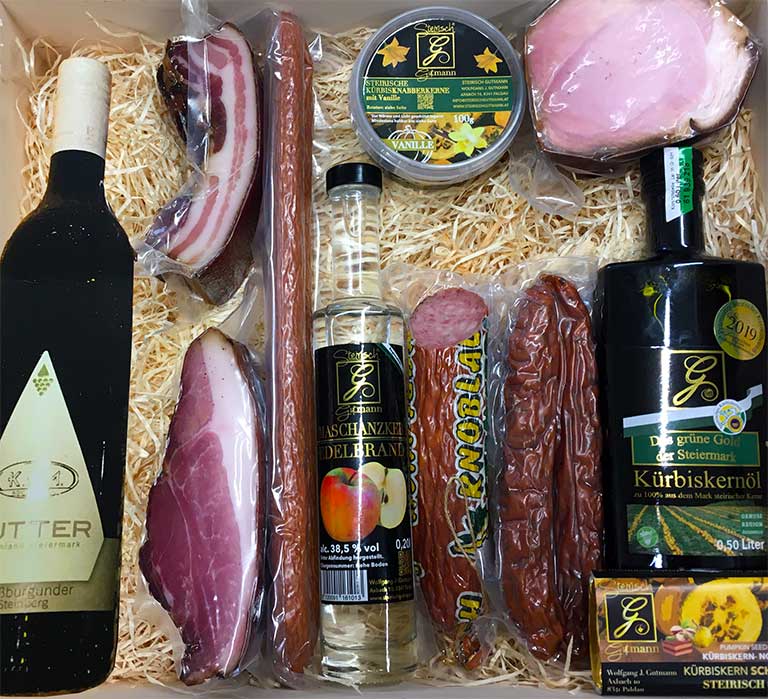 Geschenkbox Holzkiste mit Wein, Speck, Kürbiskernöl und weiteren Produkten